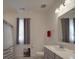 Well-lit bathroom features a vanity, mirror, toilet, and shower with neutral tones at 9786 Verdun Ct, Fort Mill, SC 29707