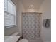 Cozy bathroom with shower featuring a shower curtain and a large window at 9786 Verdun Ct, Fort Mill, SC 29707