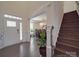 Entryway with wood floors, stairs, and a glimpse into the dining room at 9786 Verdun Ct, Fort Mill, SC 29707