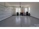 Spacious garage with an epoxy floor and lots of space for storage at 9786 Verdun Ct, Fort Mill, SC 29707