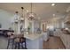 Modern kitchen with granite countertops, gray cabinetry, and pendant lighting at 9786 Verdun Ct, Fort Mill, SC 29707