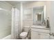 Well-lit bathroom featuring a shower-tub combination and a vanity with a single sink at 1004 Whipcord Dr, Waxhaw, NC 28173