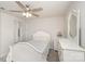 Bedroom features neutral carpet, white furniture, and ceiling fan at 1004 Whipcord Dr, Waxhaw, NC 28173