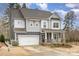 Beautiful two-story home with gray siding, a covered porch, and a well-maintained front yard at 1004 Whipcord Dr, Waxhaw, NC 28173