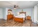 Comfortable main bedroom with a wooden dresser, white bedding, and a ceiling fan at 1004 Whipcord Dr, Waxhaw, NC 28173