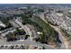 Aerial view of 1005 Sweetleaf Drive, a well-maintained townhome community with scenic pond and mature trees at 1005 Sweetleaf Dr, Fort Mill, SC 29707