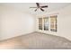 Bright bedroom with neutral carpet, ceiling fan and large windows at 1005 Sweetleaf Dr, Fort Mill, SC 29707