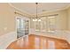 Dining area featuring hardwood floors, wainscoting, large windows, and sliding glass doors at 1005 Sweetleaf Dr, Fort Mill, SC 29707