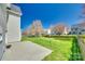 Well maintained backyard with green grass, a concrete patio and a privacy fence at 10123 Barrands Ln, Charlotte, NC 28278