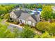 Aerial view of community clubhouse, pool, splash pad, and meticulously maintained landscaping at 10123 Barrands Ln, Charlotte, NC 28278