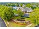 Aerial view of community clubhouse, pool, splash pad, and meticulously maintained landscaping at 10123 Barrands Ln, Charlotte, NC 28278