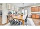 Dining area with hardwood floors, modern lighting, and built-in cabinets, perfect for Gathering meals at 10123 Barrands Ln, Charlotte, NC 28278