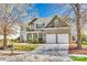 Charming two-story home boasts brick accents, manicured landscaping, and a welcoming front porch at 10123 Barrands Ln, Charlotte, NC 28278