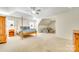 Bright main bedroom showcasing a vaulted ceiling, cozy seating area, and a four-poster bed at 10123 Barrands Ln, Charlotte, NC 28278