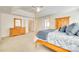 Spacious main bedroom with carpeted floor, ceiling fan and four poster bed frame at 10123 Barrands Ln, Charlotte, NC 28278