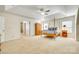 Large main bedroom showcasing a trey ceiling, ceiling fan, and a four-poster bed at 10123 Barrands Ln, Charlotte, NC 28278