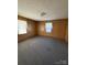 An empty bedroom features natural light coming from windows with blinds at 1027 Morningside Park Dr, Gastonia, NC 28054