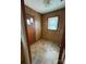 A basic laundry area with wood-paneled walls and essential hookups at 1027 Morningside Park Dr, Gastonia, NC 28054