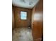 Functional laundry area features paneled walls and natural light at 1027 Morningside Park Dr, Gastonia, NC 28054