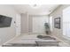 Neutral bedroom with a tv, natural light, double door closet and a decorative plant at 12207 Jessica Pl, Charlotte, NC 28269