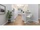 Modern kitchen with stainless appliances, breakfast bar with seating, hardwood flooring, and an open floor plan at 12207 Jessica Pl, Charlotte, NC 28269