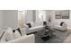 Bright living room features modern white couches, hardwood floors, and stylish decor, perfect for relaxation and entertainment at 12207 Jessica Pl, Charlotte, NC 28269