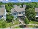 Beautiful aerial view of a two-story house with a well-maintained yard and surrounded by lush trees at 1569 Benjamen Latrobe Cir, Fort Mill, SC 29708