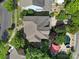 Stunning aerial view showcasing a home with a private pool, lush landscaping, and outdoor seating area at 1569 Benjamen Latrobe Cir, Fort Mill, SC 29708