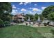 Lush backyard with a covered cabana, lounge seating and a serene pool area, ideal for outdoor enjoyment at 1569 Benjamen Latrobe Cir, Fort Mill, SC 29708