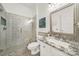 Elegant bathroom featuring a glass-enclosed shower and granite countertop vanity at 1569 Benjamen Latrobe Cir, Fort Mill, SC 29708