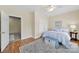 Cozy bedroom with wood floors, neutral walls, ceiling fan and blue accents, including a stylish trunk at 1569 Benjamen Latrobe Cir, Fort Mill, SC 29708
