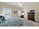 Bedroom featuring carpet, shuttered windows, and a wood dresser at 1569 Benjamen Latrobe Cir, Fort Mill, SC 29708