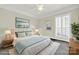 Bright bedroom with light walls, shuttered windows, a ceiling fan and a plush bed at 1569 Benjamen Latrobe Cir, Fort Mill, SC 29708