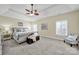 Generous bedroom showcases tray ceilings, plush carpeting and an abundance of natural light at 1569 Benjamen Latrobe Cir, Fort Mill, SC 29708