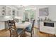 Charming breakfast nook features a round table, stylish chairs, and natural light at 1569 Benjamen Latrobe Cir, Fort Mill, SC 29708