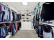 Walk-in closet with ample storage shelves and hanging rods for organized living at 1569 Benjamen Latrobe Cir, Fort Mill, SC 29708