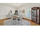 Cozy dining area featuring wood floors, large windows with shutters, area rug and natural light at 1569 Benjamen Latrobe Cir, Fort Mill, SC 29708
