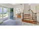 Inviting foyer showcasing a staircase and access to a home office, featuring an open and airy design at 1569 Benjamen Latrobe Cir, Fort Mill, SC 29708