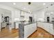 Spacious kitchen featuring a center island, modern appliances, and bright lighting for an open and airy feel at 1569 Benjamen Latrobe Cir, Fort Mill, SC 29708