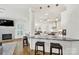 Open kitchen design with marble countertops, breakfast bar, and pendant lighting at 1569 Benjamen Latrobe Cir, Fort Mill, SC 29708