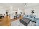 Spacious living room with hardwood floors, stylish furniture, and an open floor plan at 1569 Benjamen Latrobe Cir, Fort Mill, SC 29708