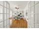 Bright home office with custom built-in bookshelves, hardwood floors, and French doors for a private workspace at 1569 Benjamen Latrobe Cir, Fort Mill, SC 29708