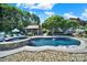Inviting backyard oasis features a sparkling pool, hot tub and cabana, perfect for relaxing and entertaining at 1569 Benjamen Latrobe Cir, Fort Mill, SC 29708
