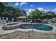 Backyard pool featuring a jacuzzi, small pool house, and water fountain at 1569 Benjamen Latrobe Cir, Fort Mill, SC 29708