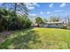 Large backyard with lush greenery and a view of the house at 1749 Archdale Dr, Charlotte, NC 28210