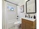 Bathroom featuring tile floor and walls, and wood vanity at 1749 Archdale Dr, Charlotte, NC 28210