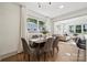 Dining room with hardwood flooring, windows, and view into the living room at 1749 Archdale Dr, Charlotte, NC 28210