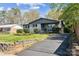 Charming single-Gathering home with a well-manicured lawn, driveway, and inviting curb appeal at 1749 Archdale Dr, Charlotte, NC 28210