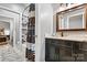 Bathroom featuring a shower, decorative mirror, and under sink storage space at 188 Winding Forest Dr, Troutman, NC 28166