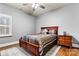 Bedroom with a cozy bed, warm colors, and side table at 188 Winding Forest Dr, Troutman, NC 28166